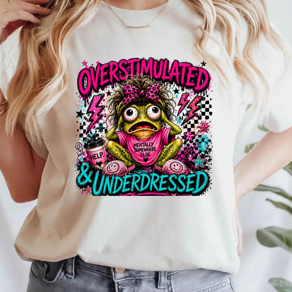 Bright neon comic-style frog design featuring a frazzled frog with bold “Overstimulated & Underdressed” lettering, playful grunge details, and vibrant pink and teal colors.